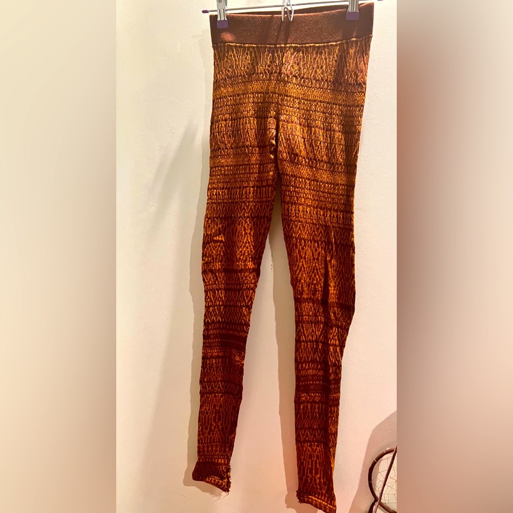 Free people, winter leggings, rusty shade of brown with an Aztec pattern